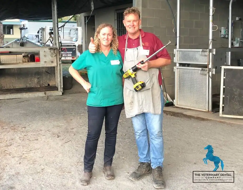 dr olivia james and dr oliver liyou standing together in a horse barn